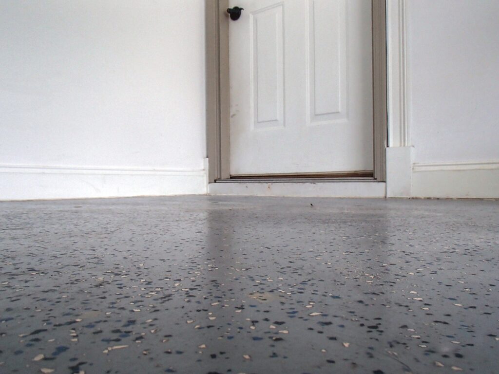 66048727695e1_cnrescrpolylevelgarage-floor01after a white door with a black door
